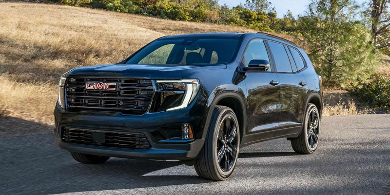 2026 GMC Acadia blue SUV parked outdoors
